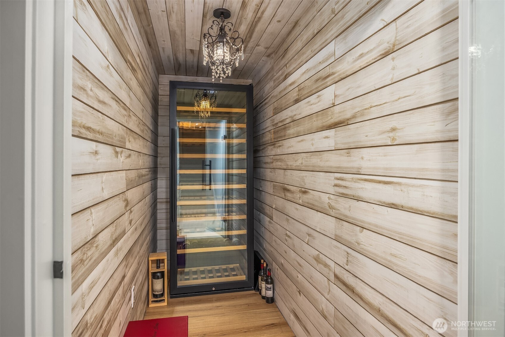 The fully remodeled lower level shines with this beautiful wine cellar. The room is sealed and has temperature controlled capabilities with thermostat.