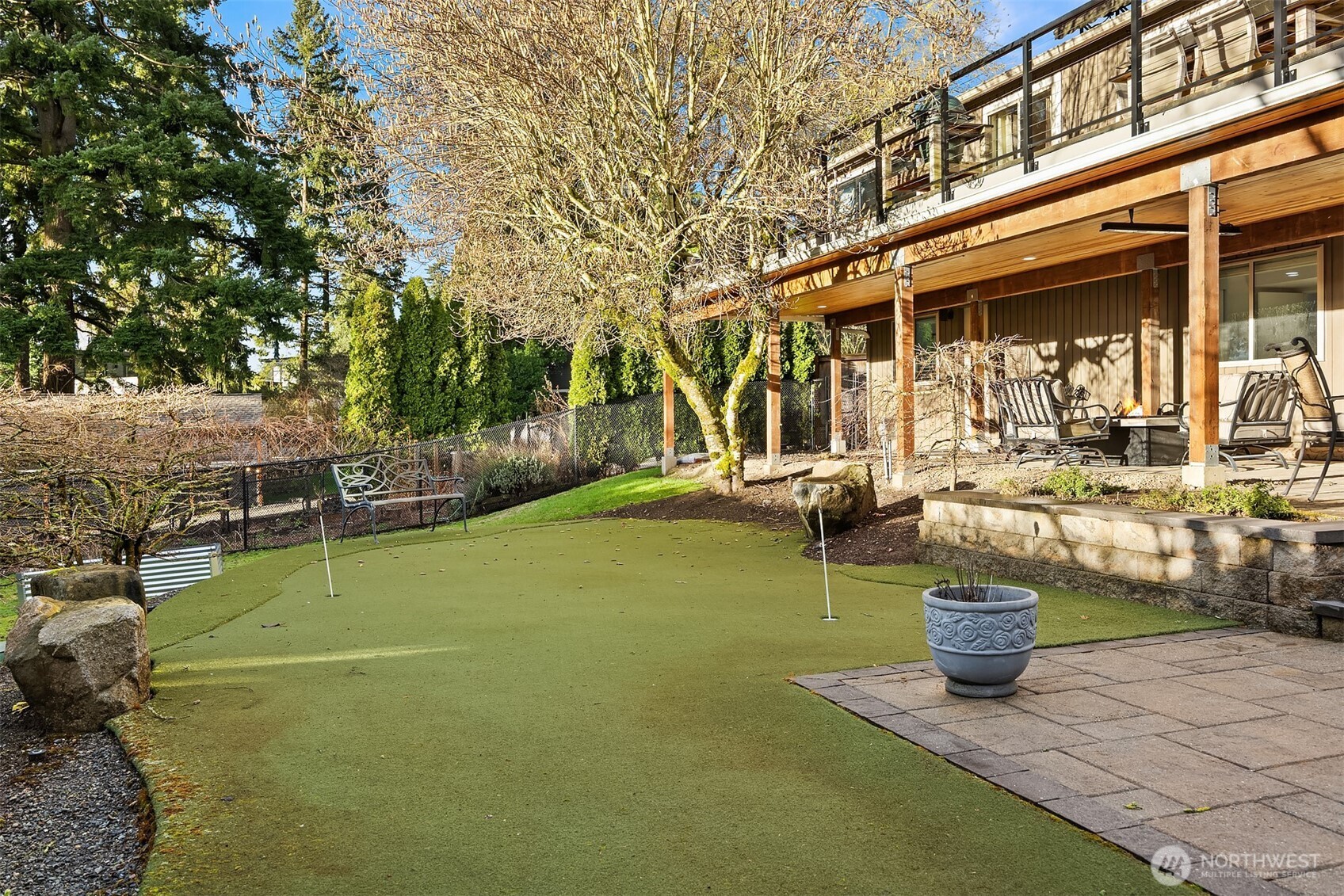 This 60 foot putting turf is sure to keep your game sharp! All the yard and planters have irrigation.