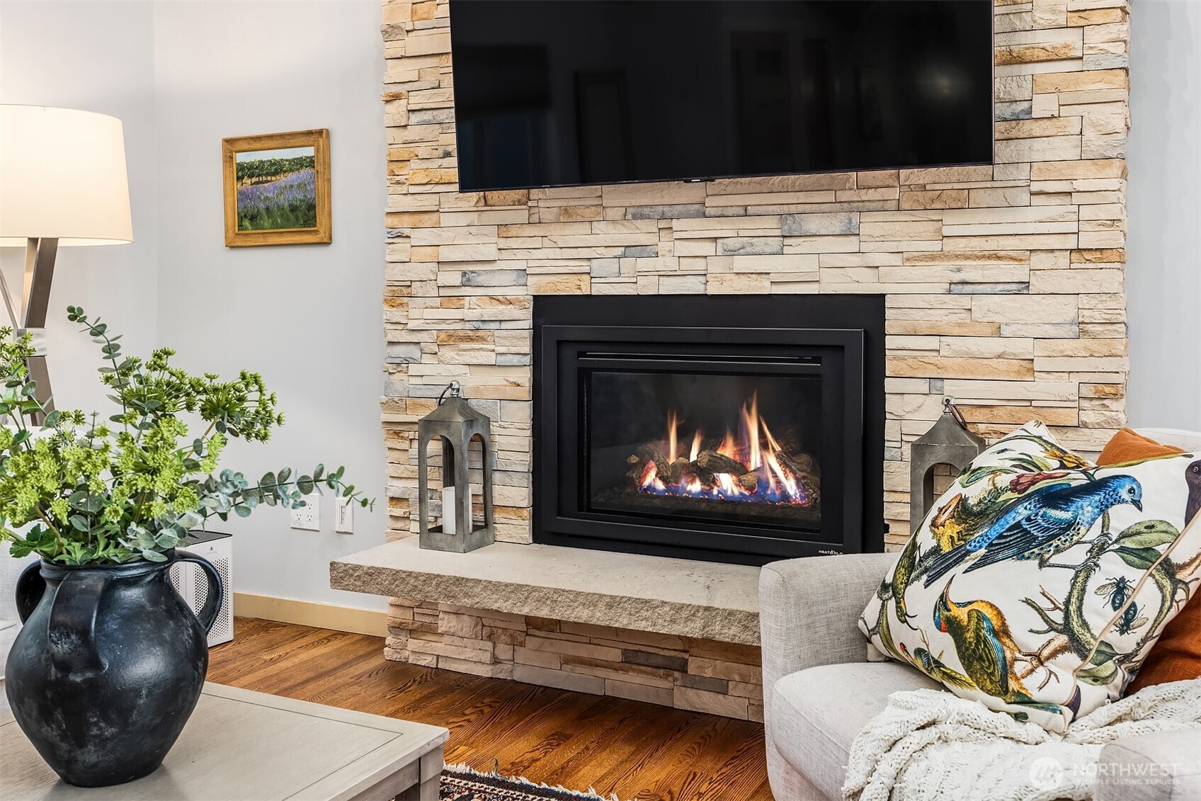This gorgeous, floor to ceiling stacked stone fireplace and hearth are part of the home's recent updates.
