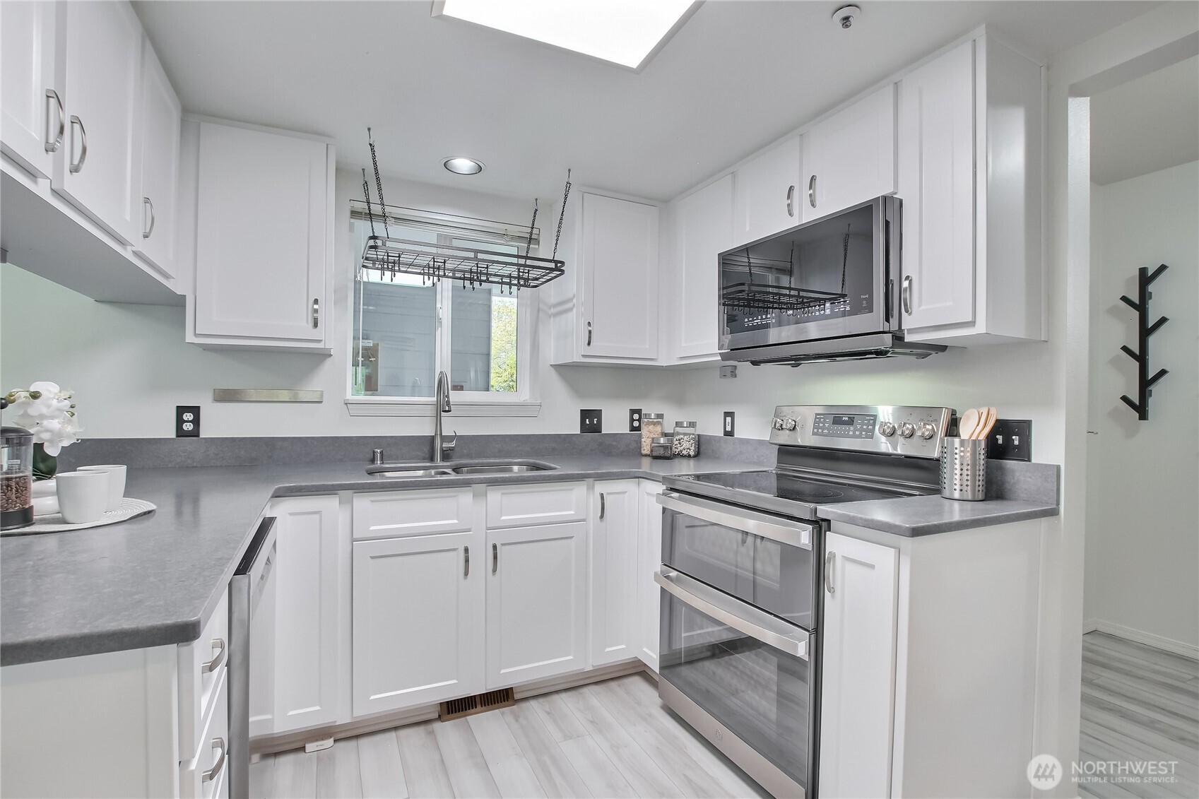 Upgraded kitchen with stainless appliances and refaced cabinetry