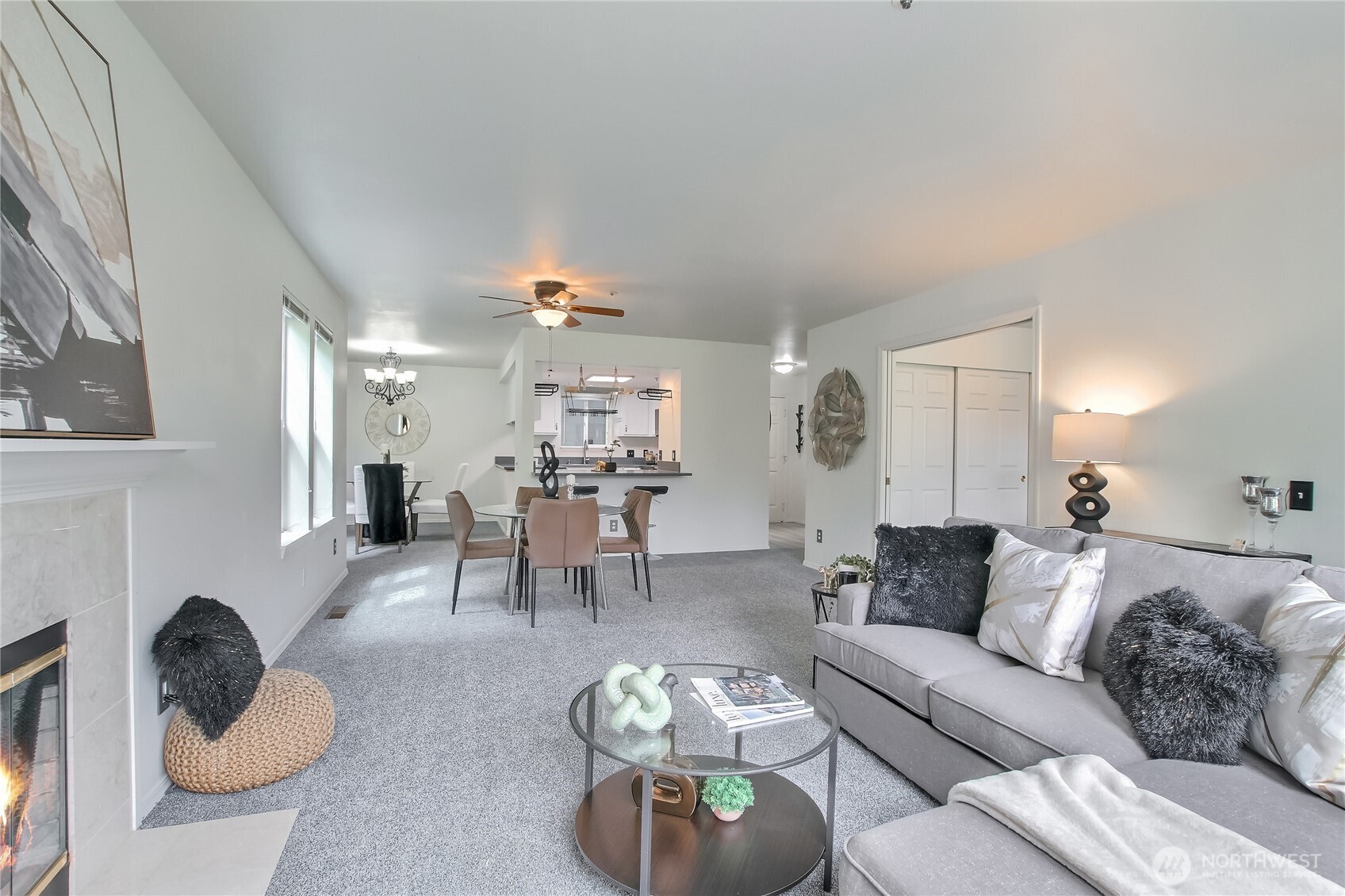 living and dining room with fireplace and door to patio