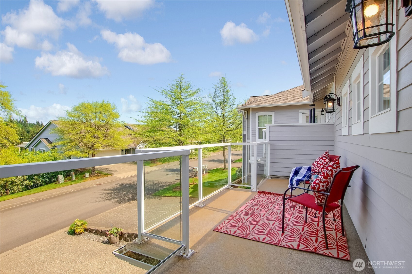 Spacious deck looks over the neighborhood and to the mountains beyond.