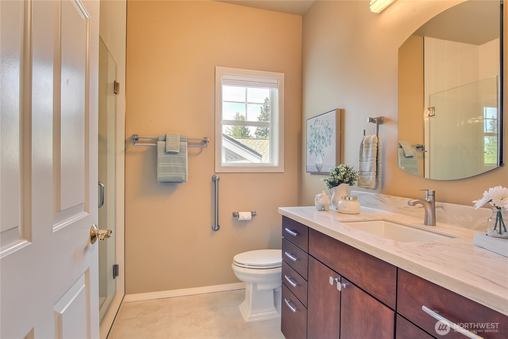 Second bedroom with tile surround and upgraded vanity and countertops.