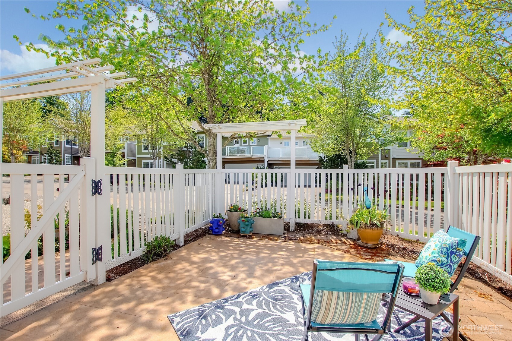 Garden gate with arbor over walkway.
