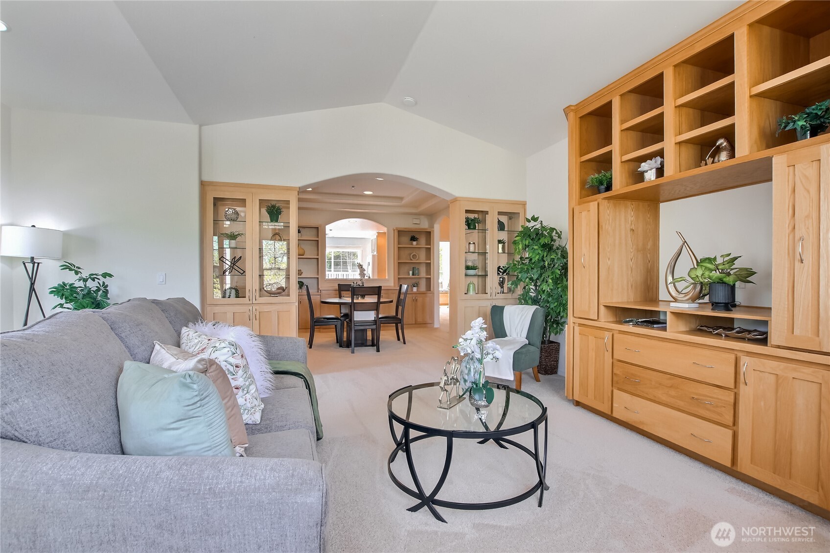 Living room with custom built entertainment center with storage.