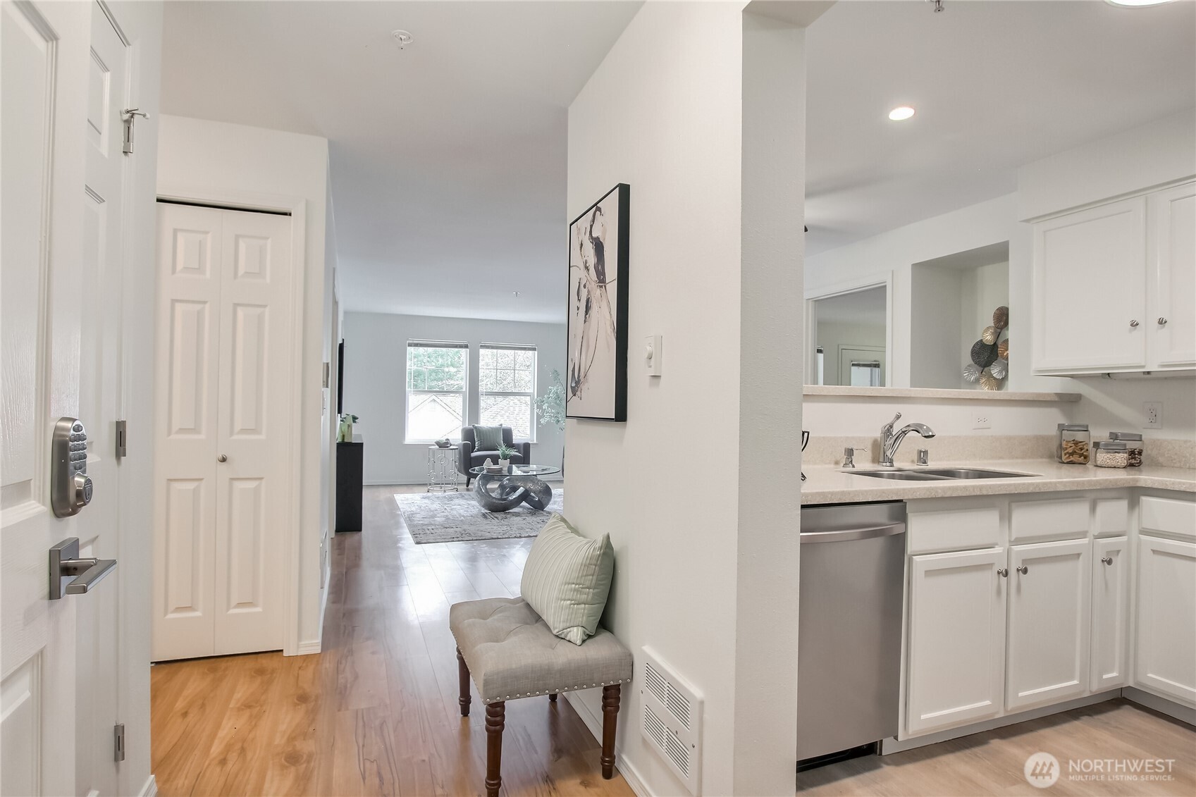 Enter to beautiful condo with solid surface flooring throughout.