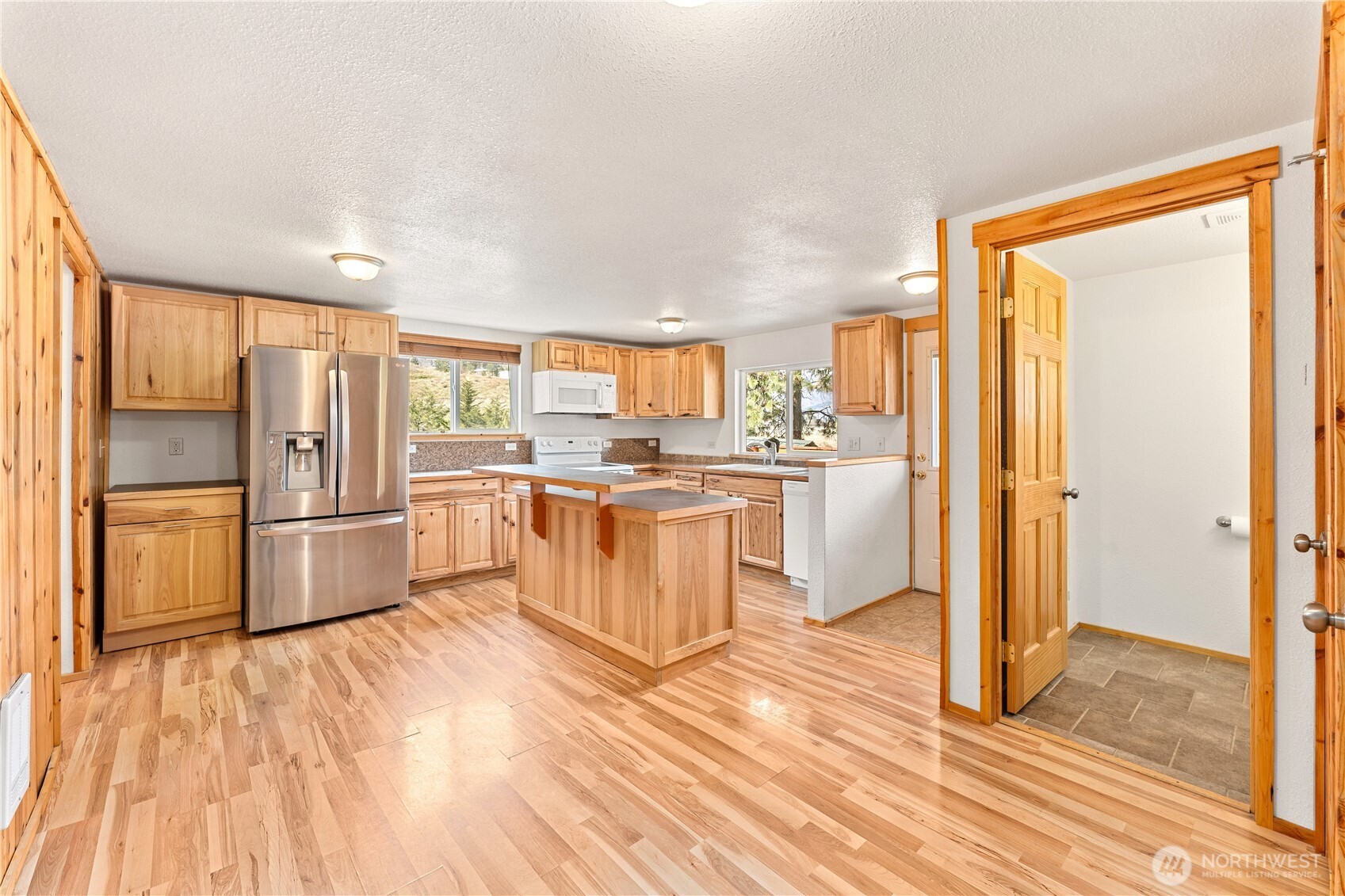 Upper Level Kitchen - View towards Upper Level Powder Room.