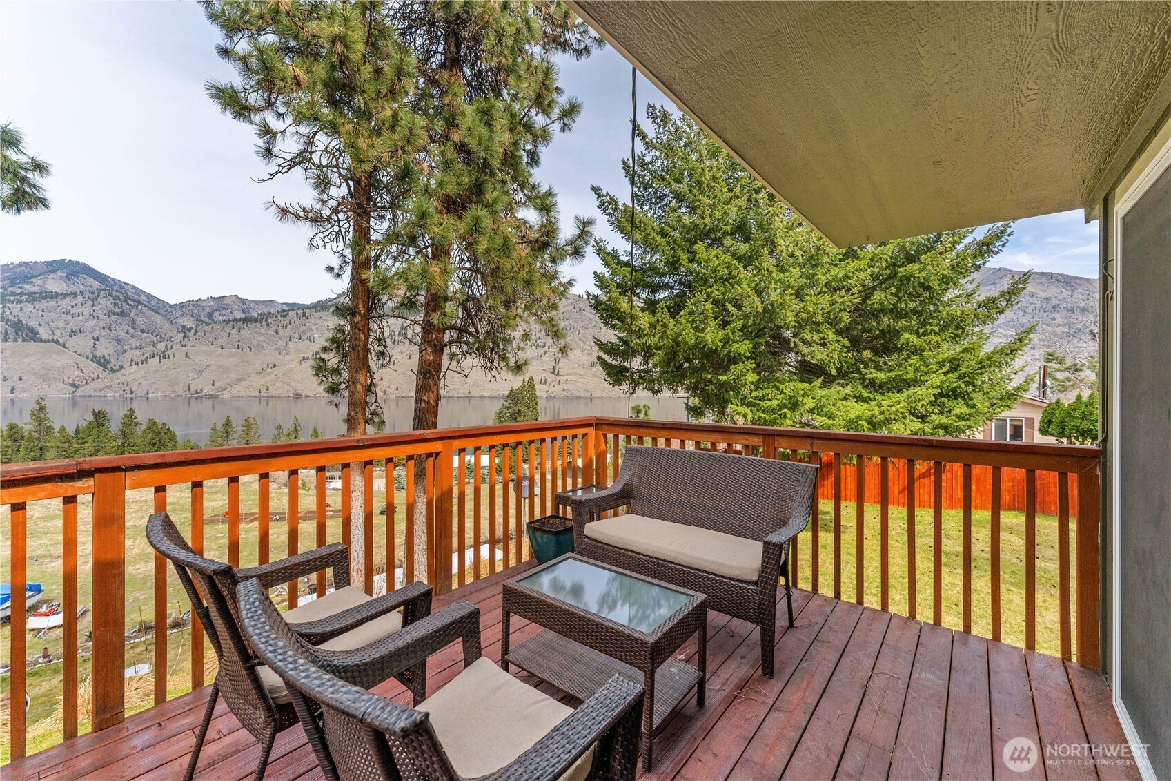 Upper Level lake view deck w/ sitting area.