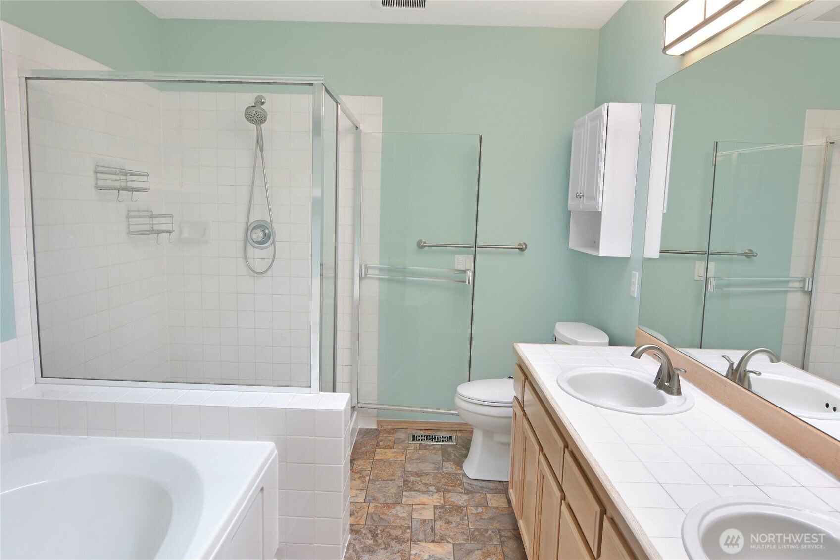 Well lit primary bathroom