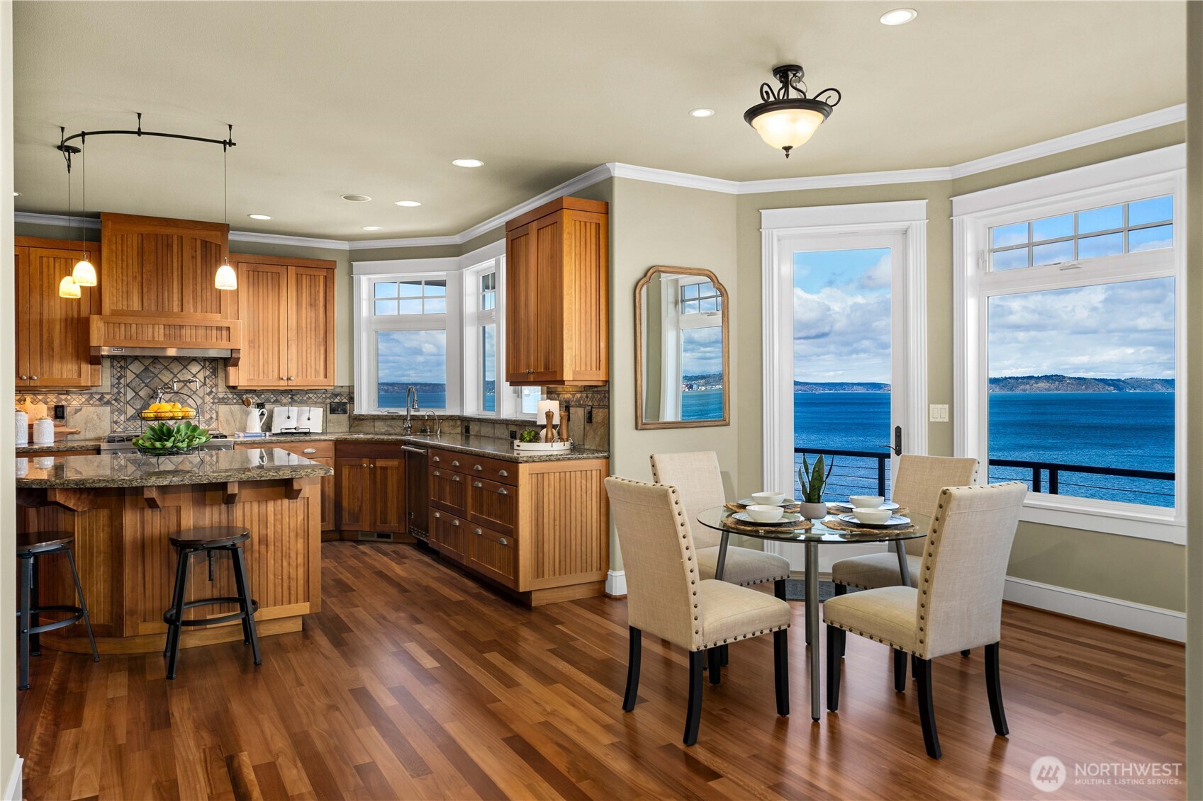 The open concept design on the main floor celebrates the view from the living room to the kitchen