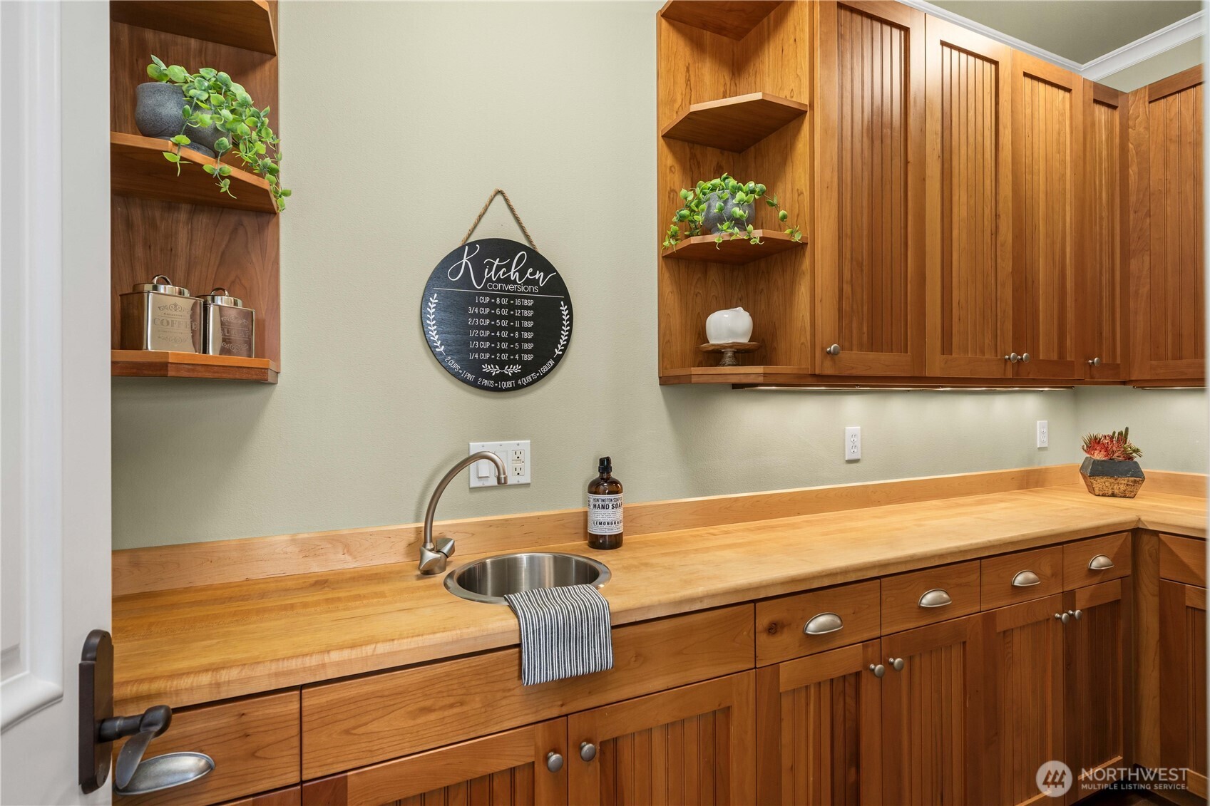 This is the butler's pantry and wet bar adjacent to the kitchen