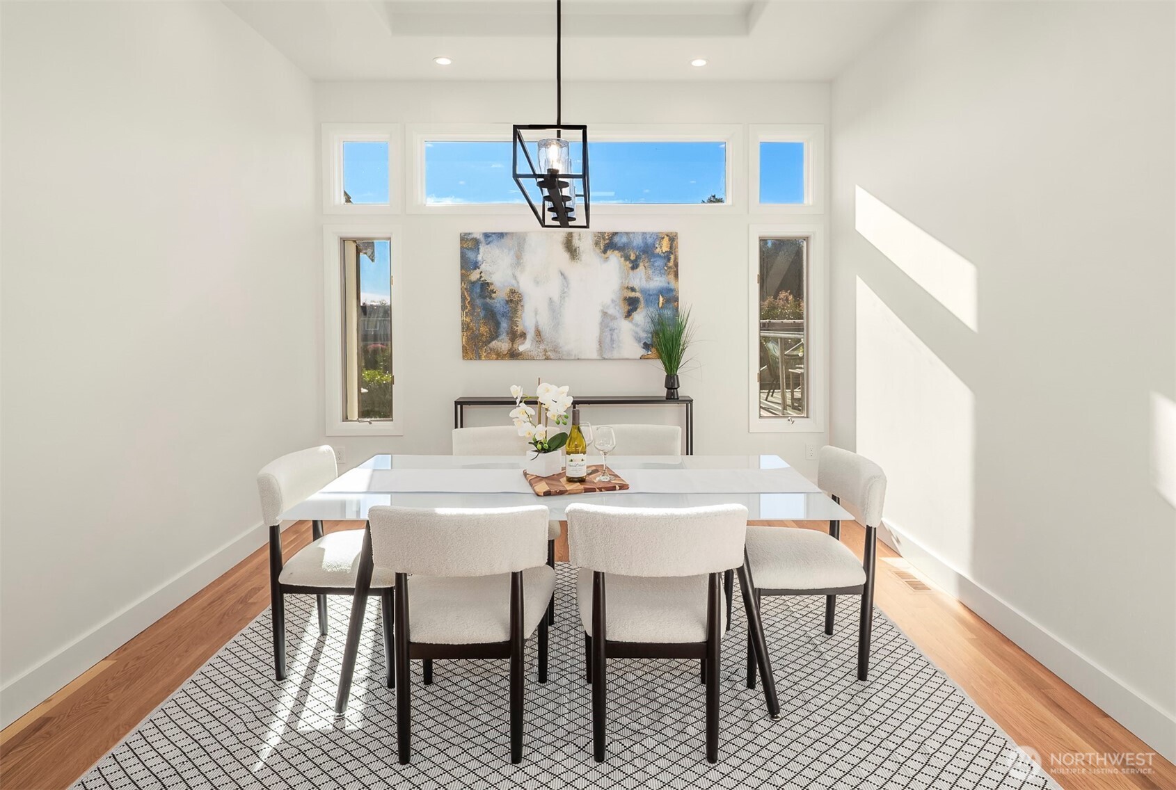 Formal dining — elegant table framed by soft light, perfect for intimate dinners and grand celebrations.