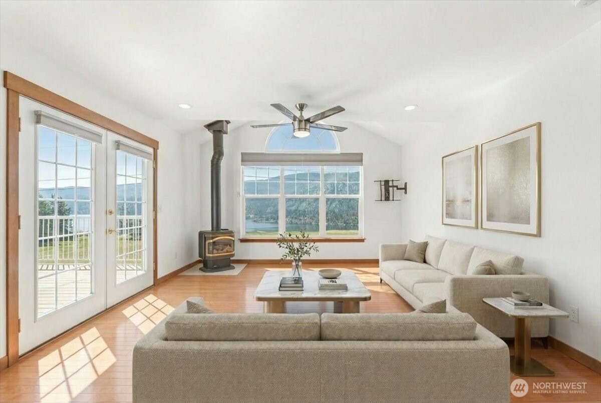 Virtually Staged Upstairs family room with french doors out to the deck