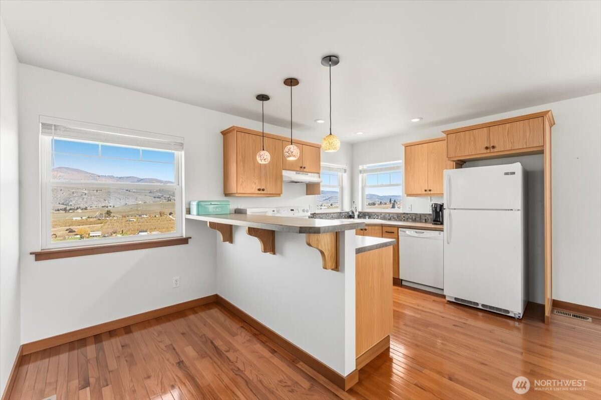 Kitchen in living space above the shop with bar style seating