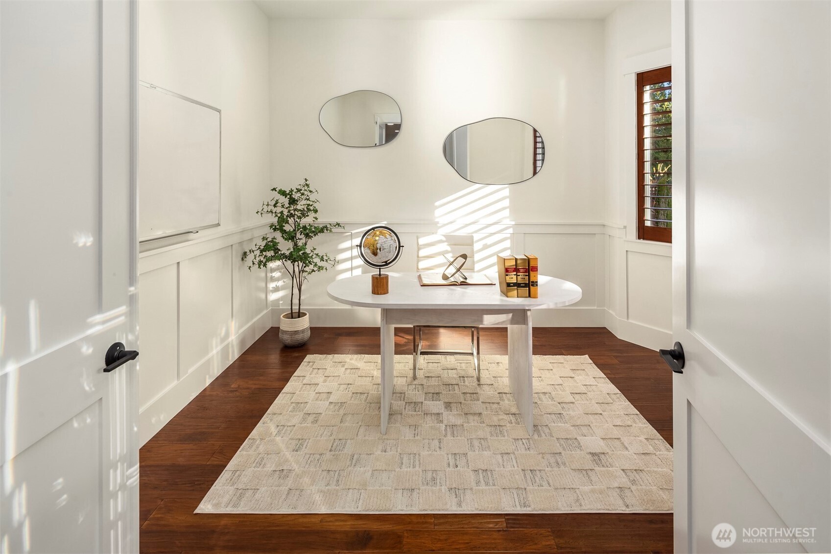 Private office on the main with refined finishes—ideal for focused work and quiet productivity.