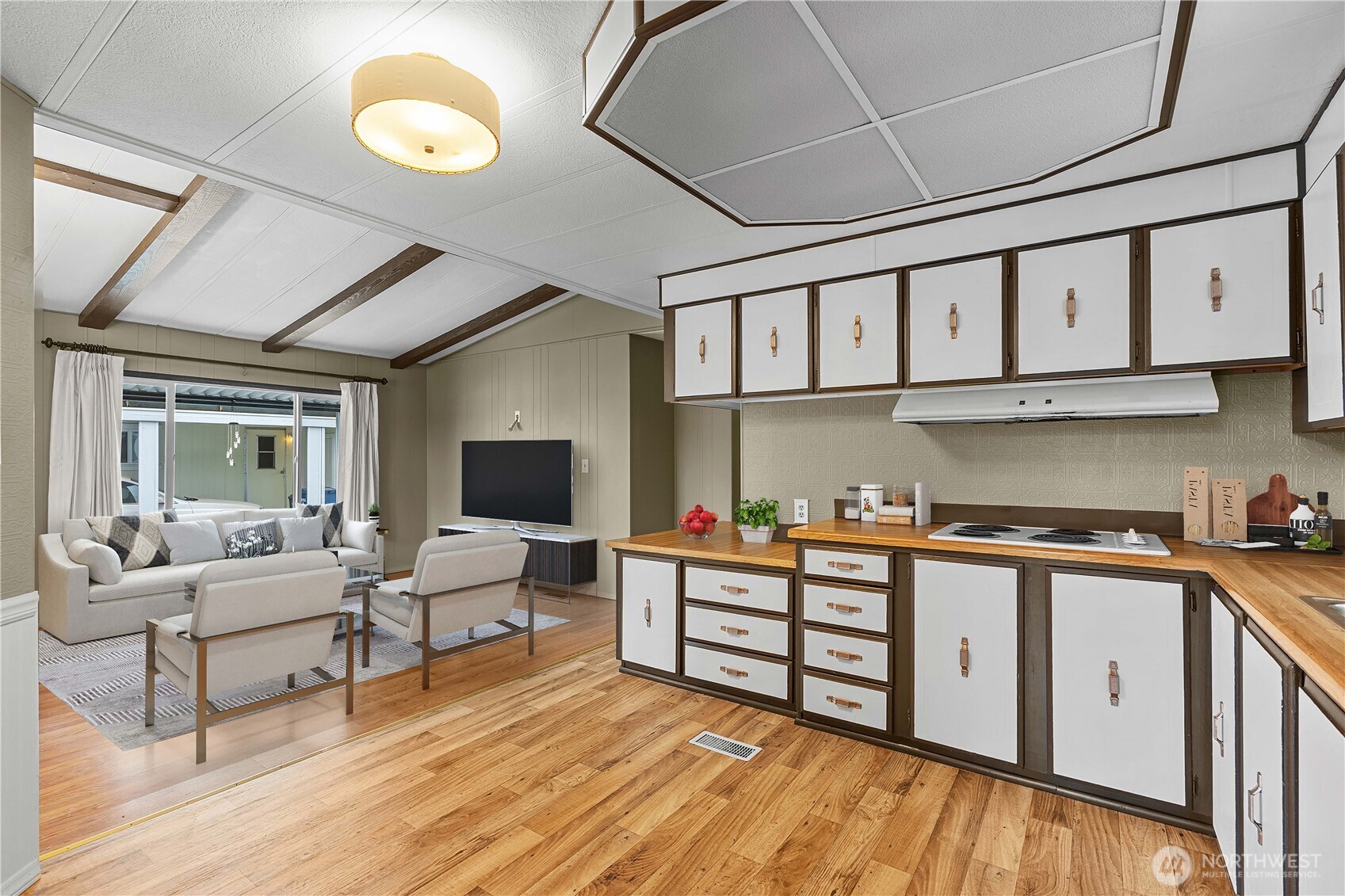 This photo is virtually staged.  You can see how you could arrange seating and the tv.