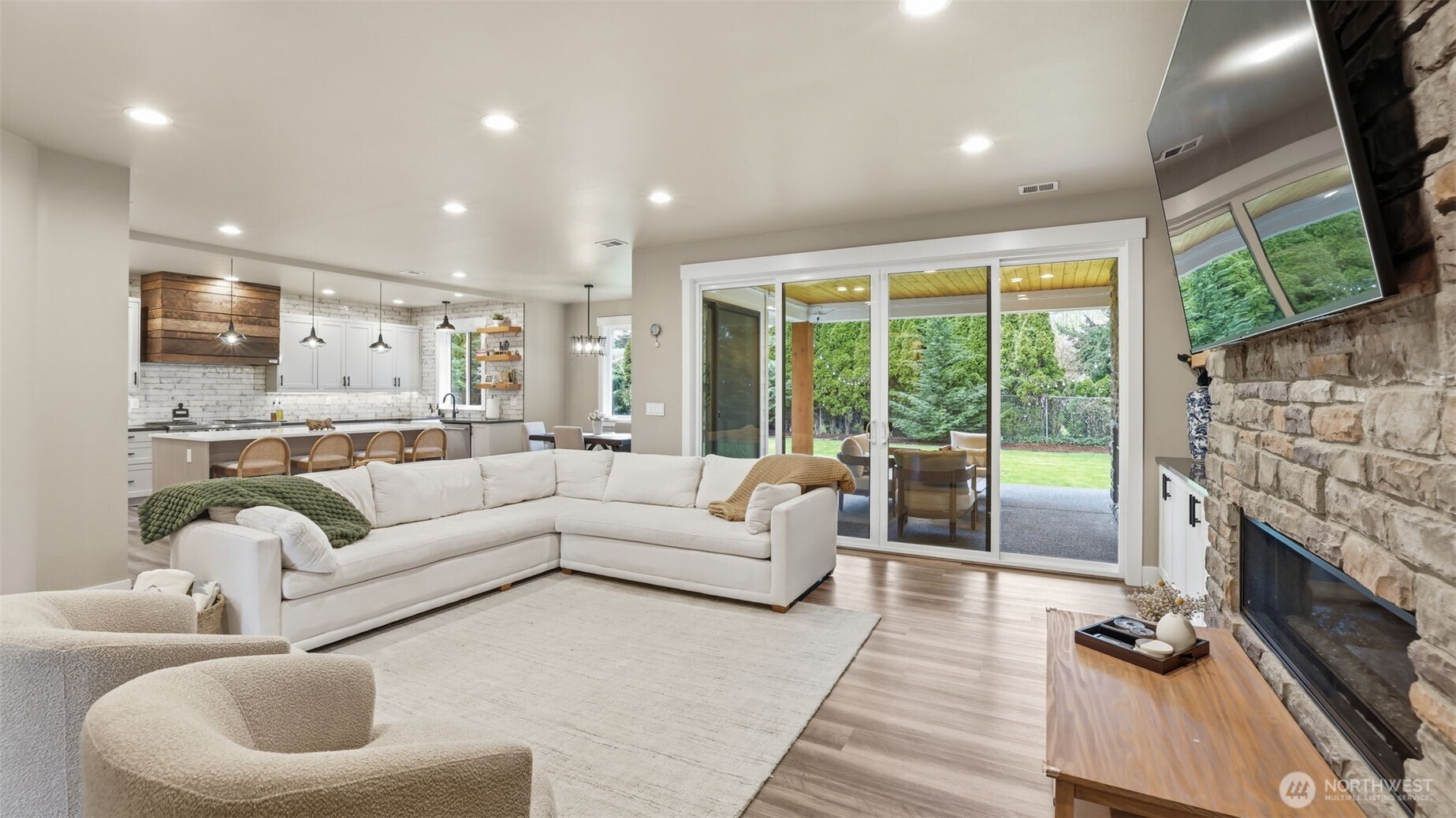 Open concept design with easy flow into the kitchen, dining area, and outdoor living space.