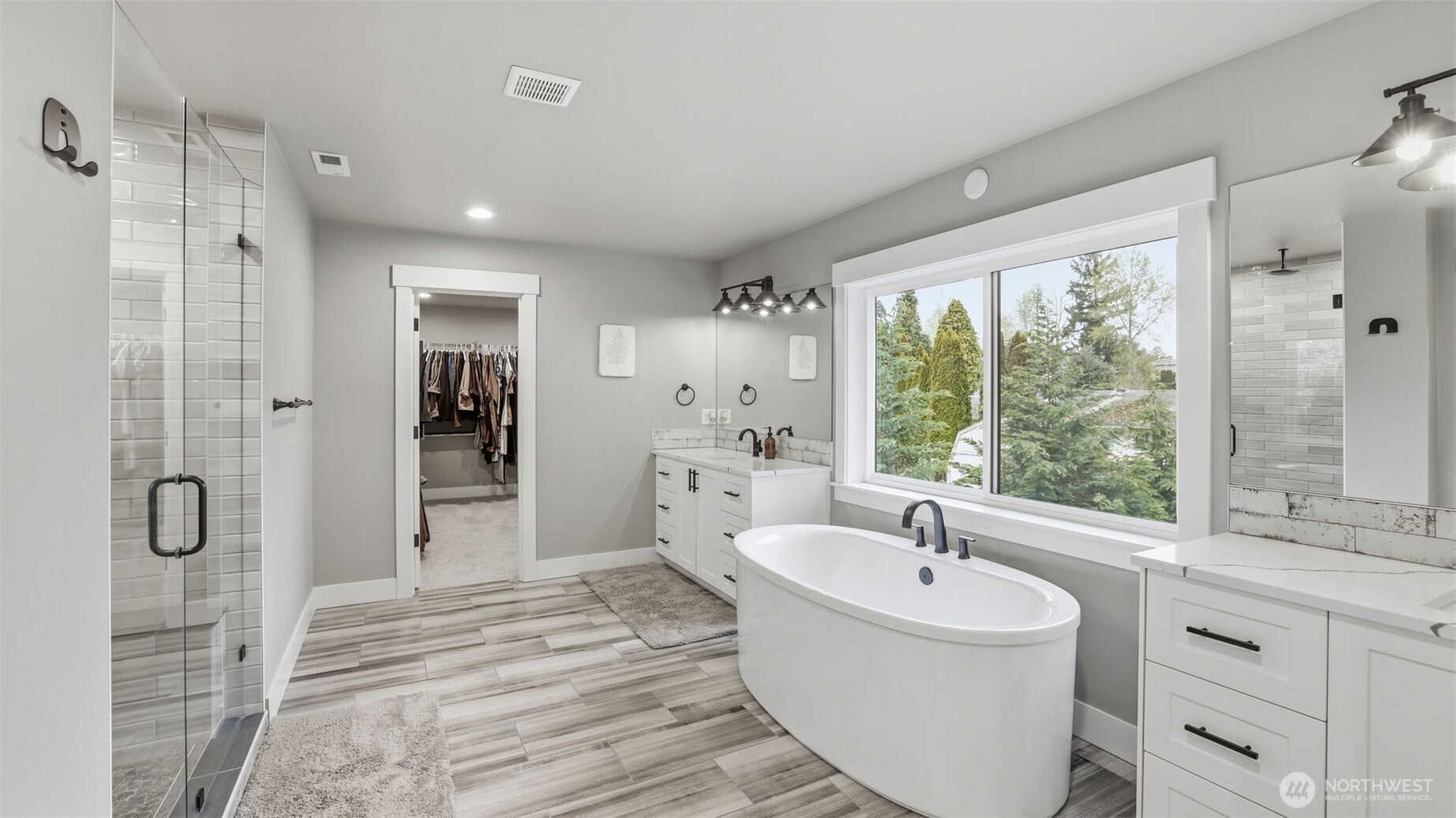 LPV flooring and double sinks with quartz countertops.