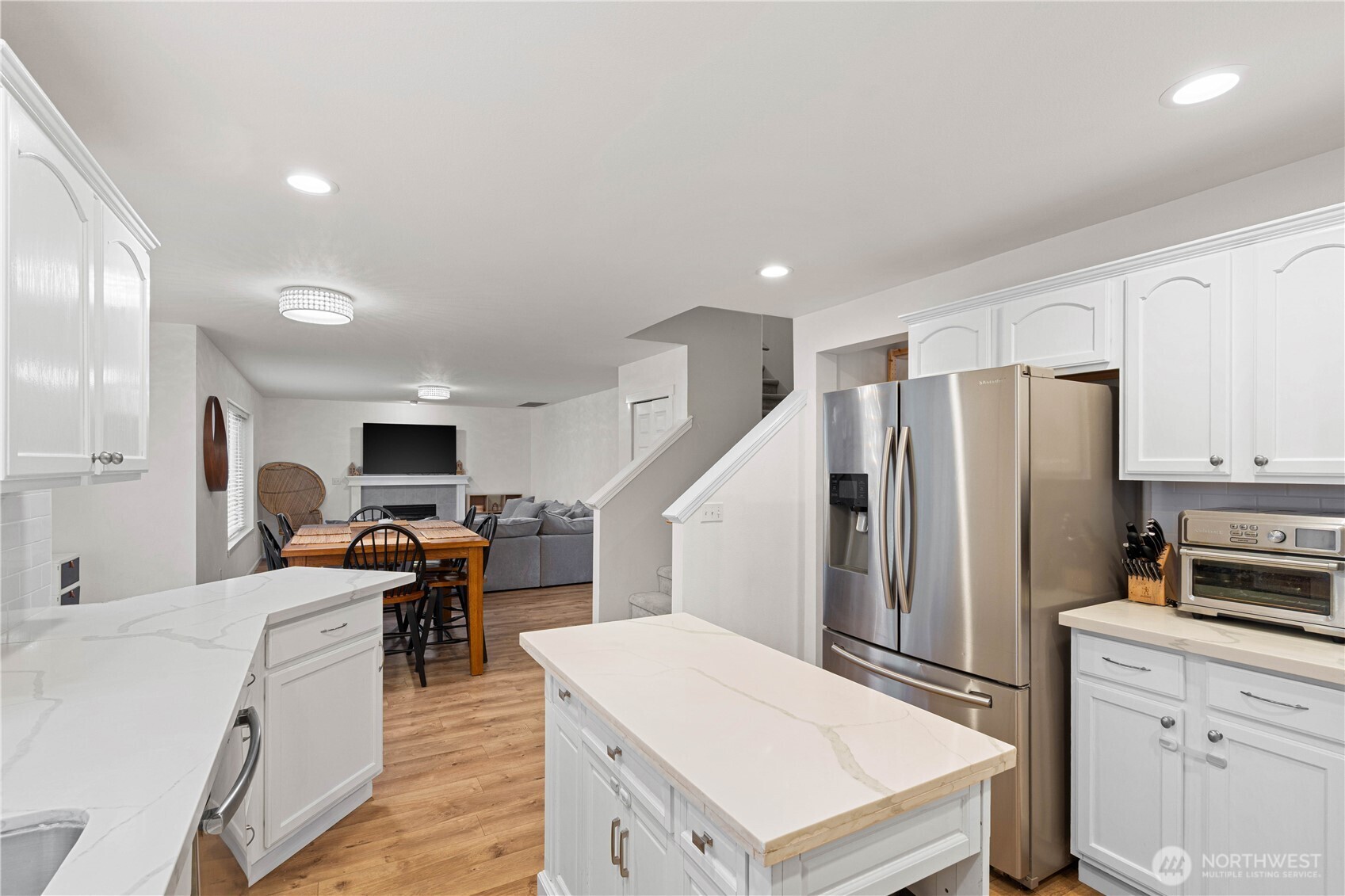 Kitchen with eat-in dining space opens to family room.