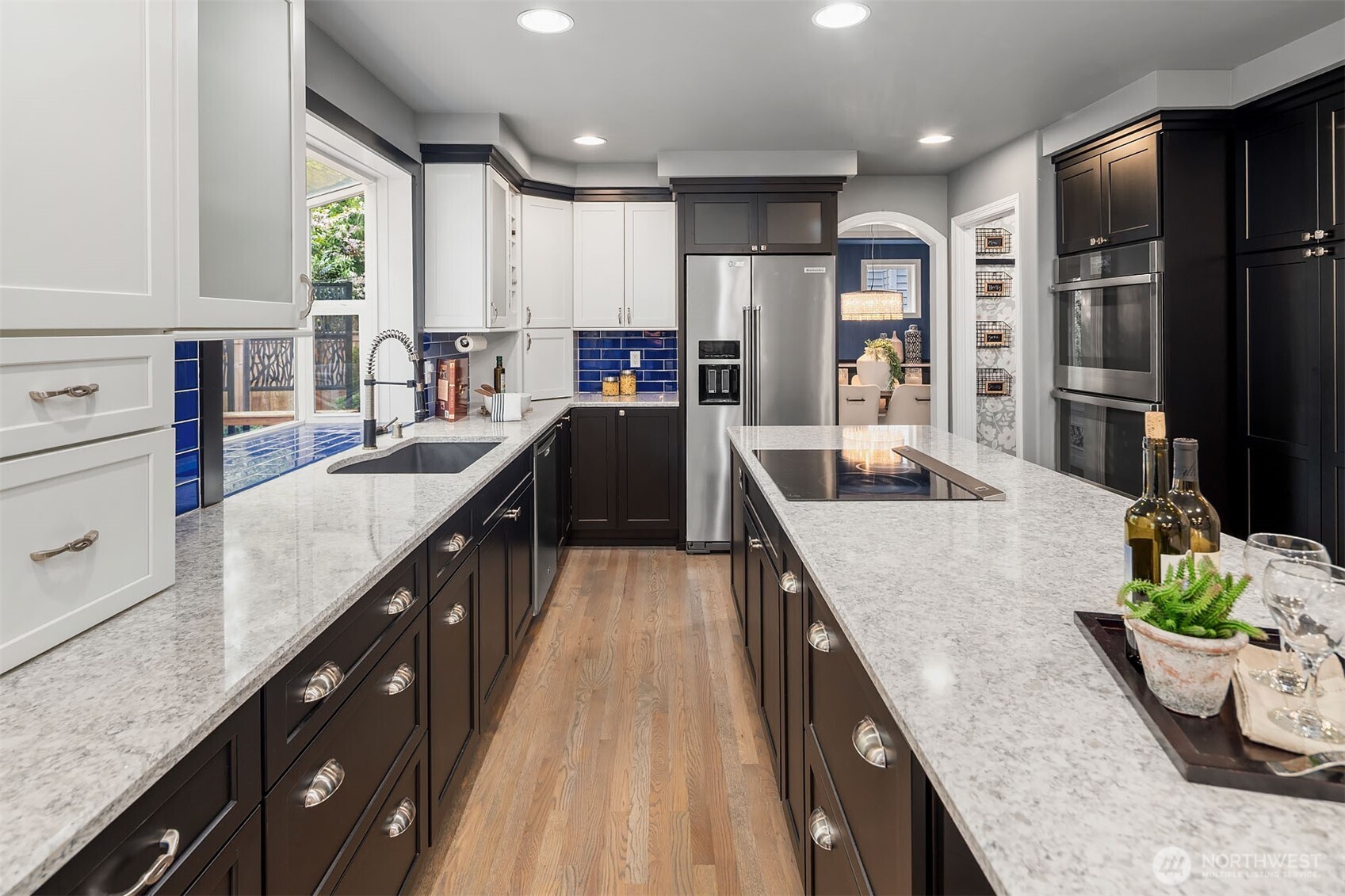 New quartz counters, induction cooktop (plumbed for gas), custom cabinets, and more!