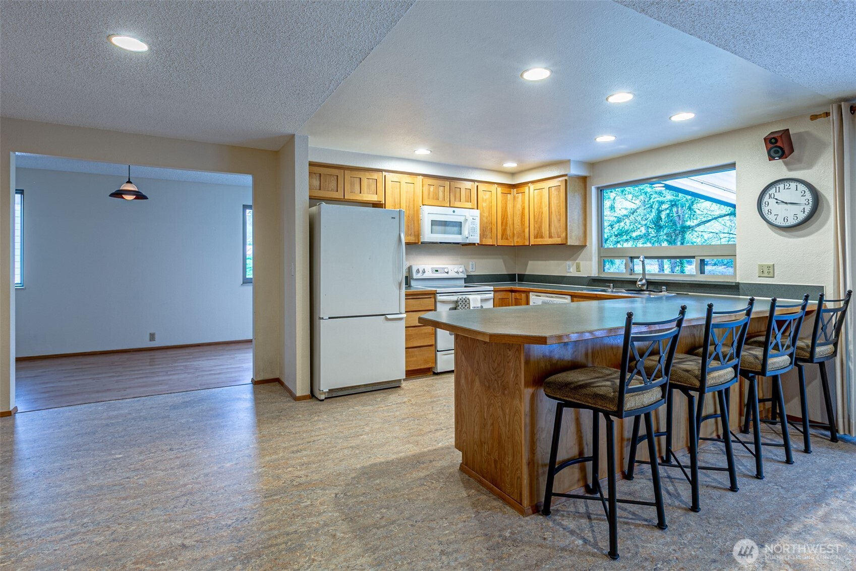 The bonus room, with its window seat, is right next to the kitchen.So inviting!