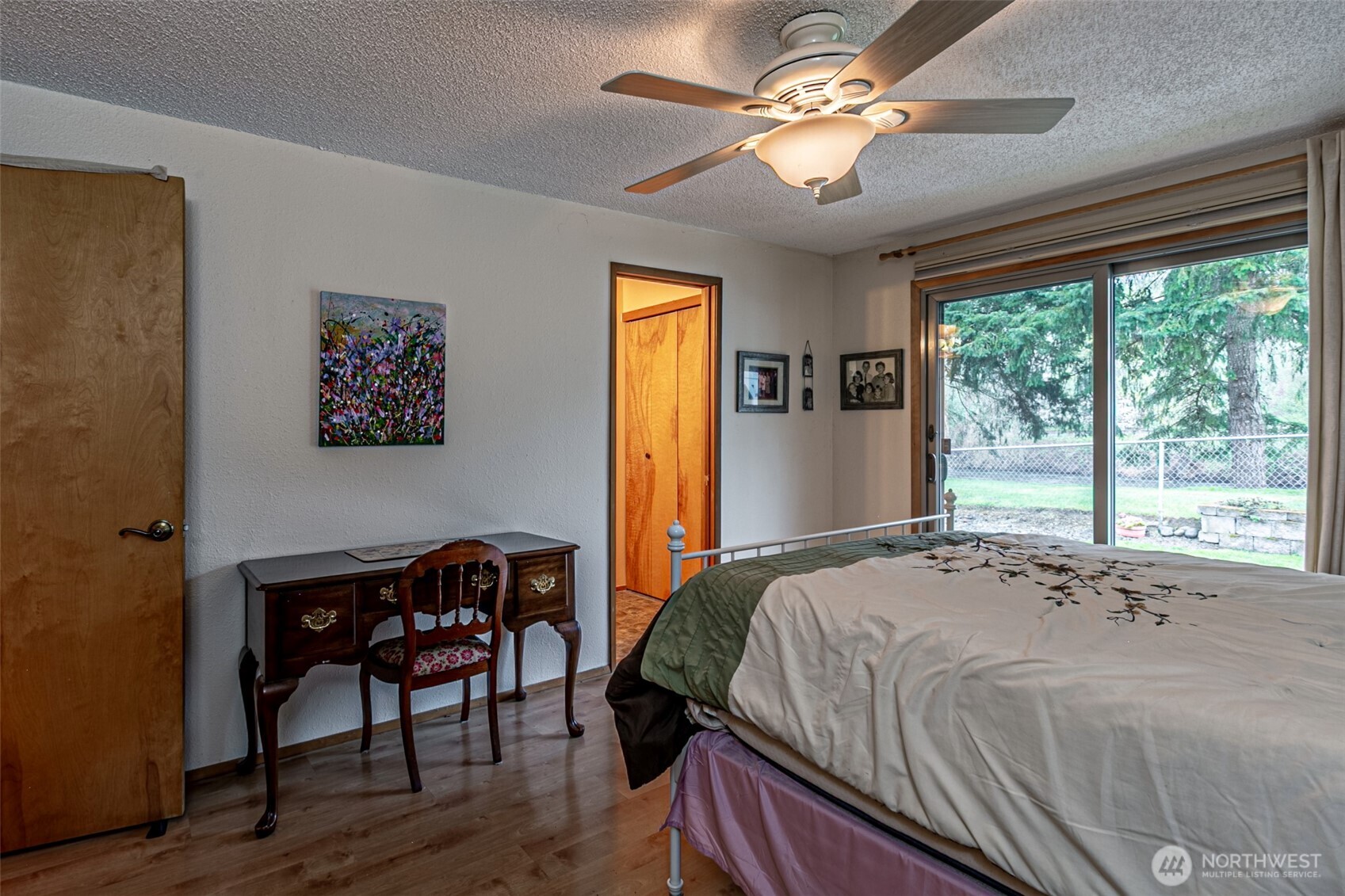 The primary bedroom has a patio door out to the river.