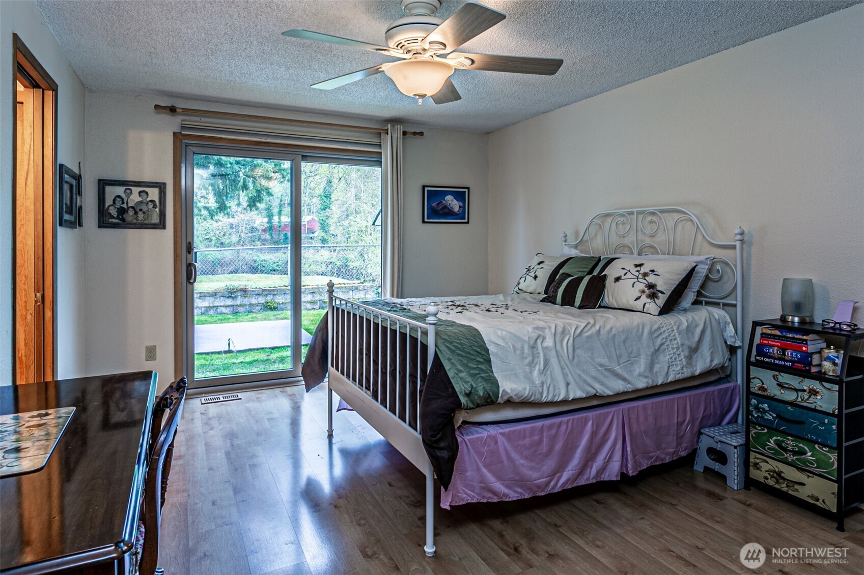 The primary bedroom. and it's sliding glass doors for easy patio access.
