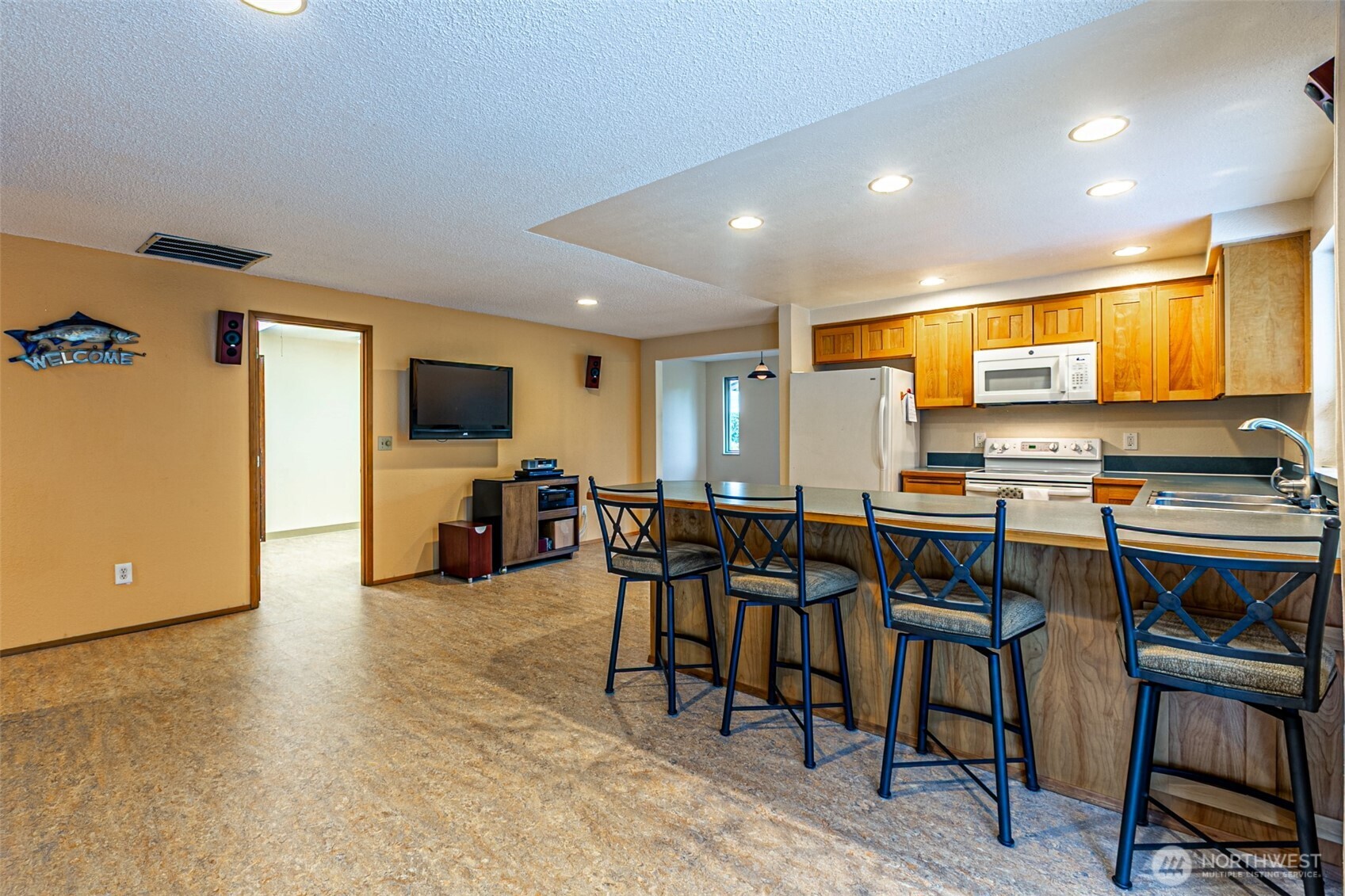This photo, showing the kitchen is taken from the dining room's patio door.