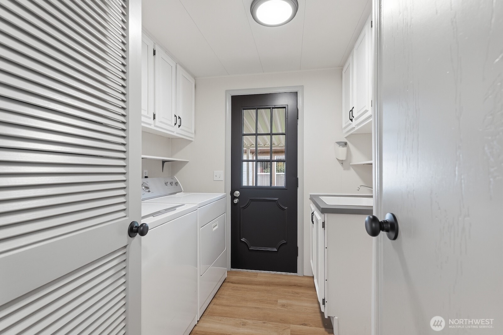 Laundry room with access to the carport