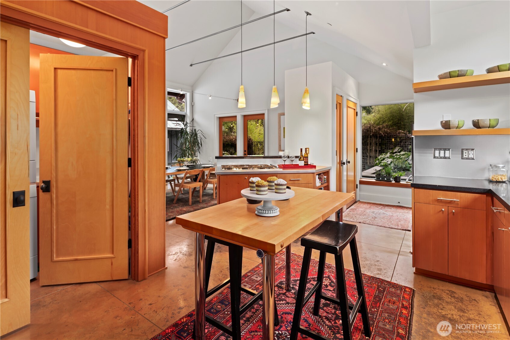 Open door to the left to the laundry w/ utility sink