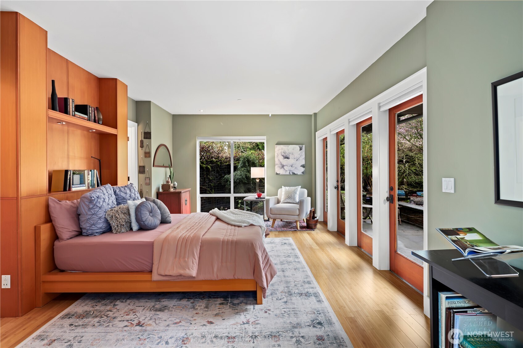 The primary en-suite is just off the living room, and looks out to the courtyard