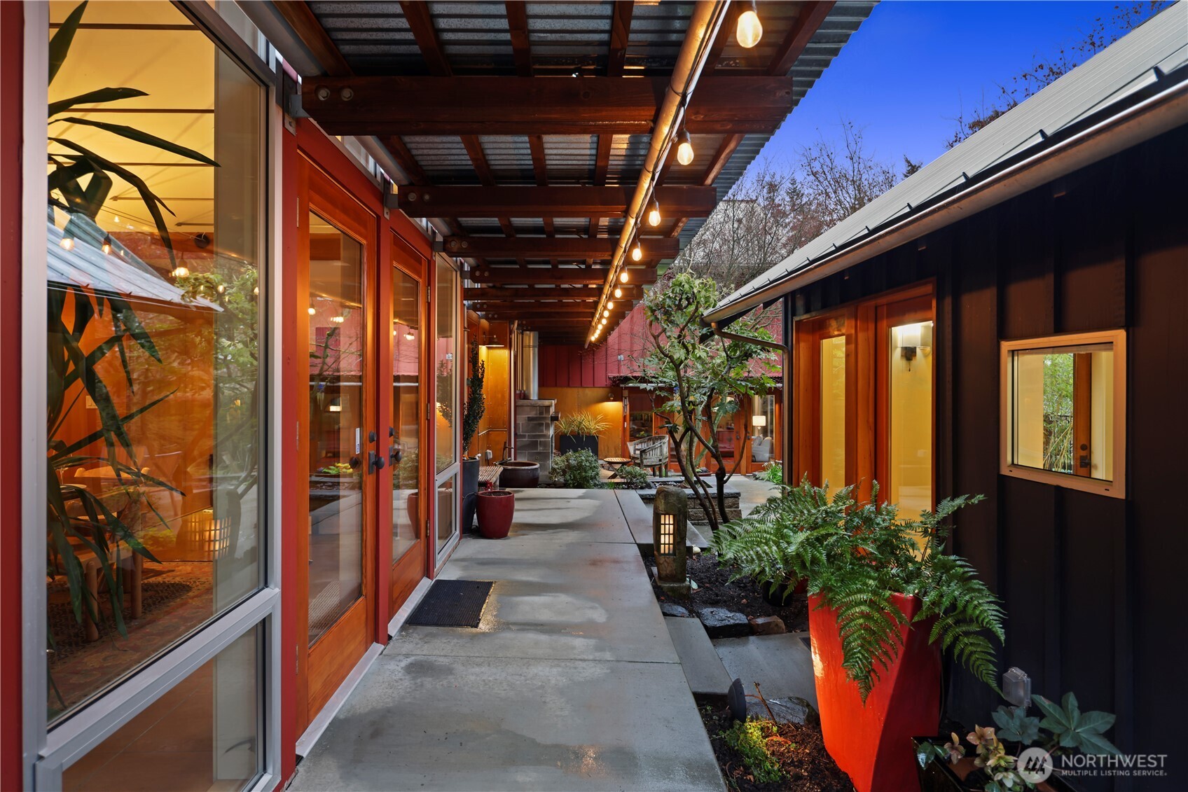 Breezeway from the driveway...detached studio on the right.