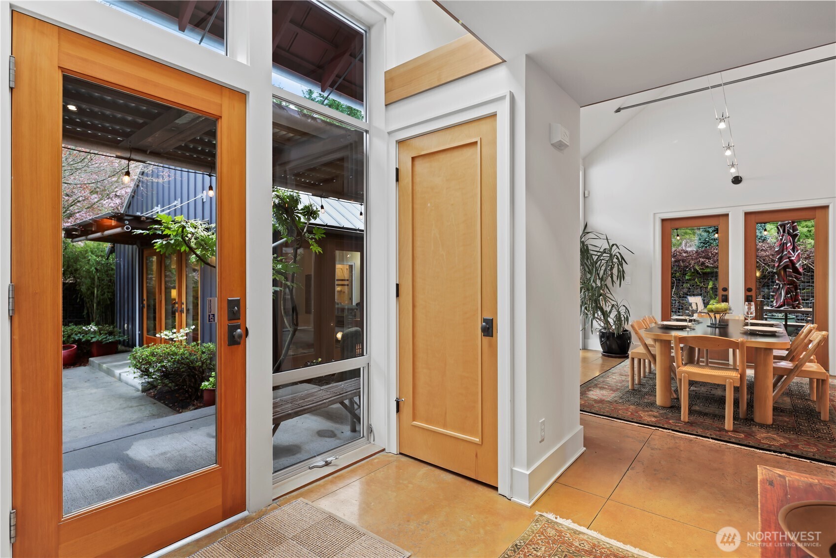 As you come in the dining room with doors to the breezeway are to your left...