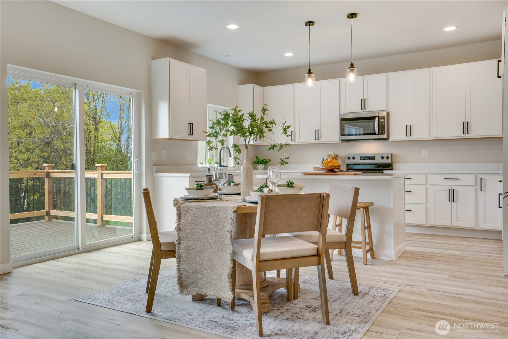 Sliding glass doors to the view deck with a territorial view, with city lights in the background.