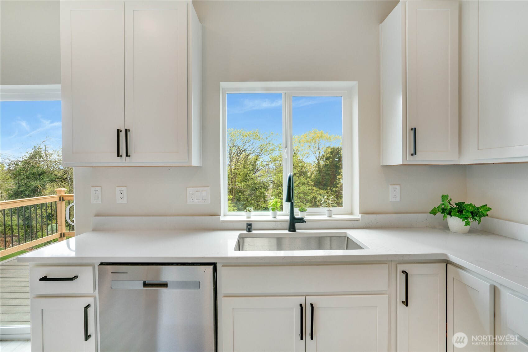We love a kitchen sink with a view!  This well appointed new kitchen awaits your touches.