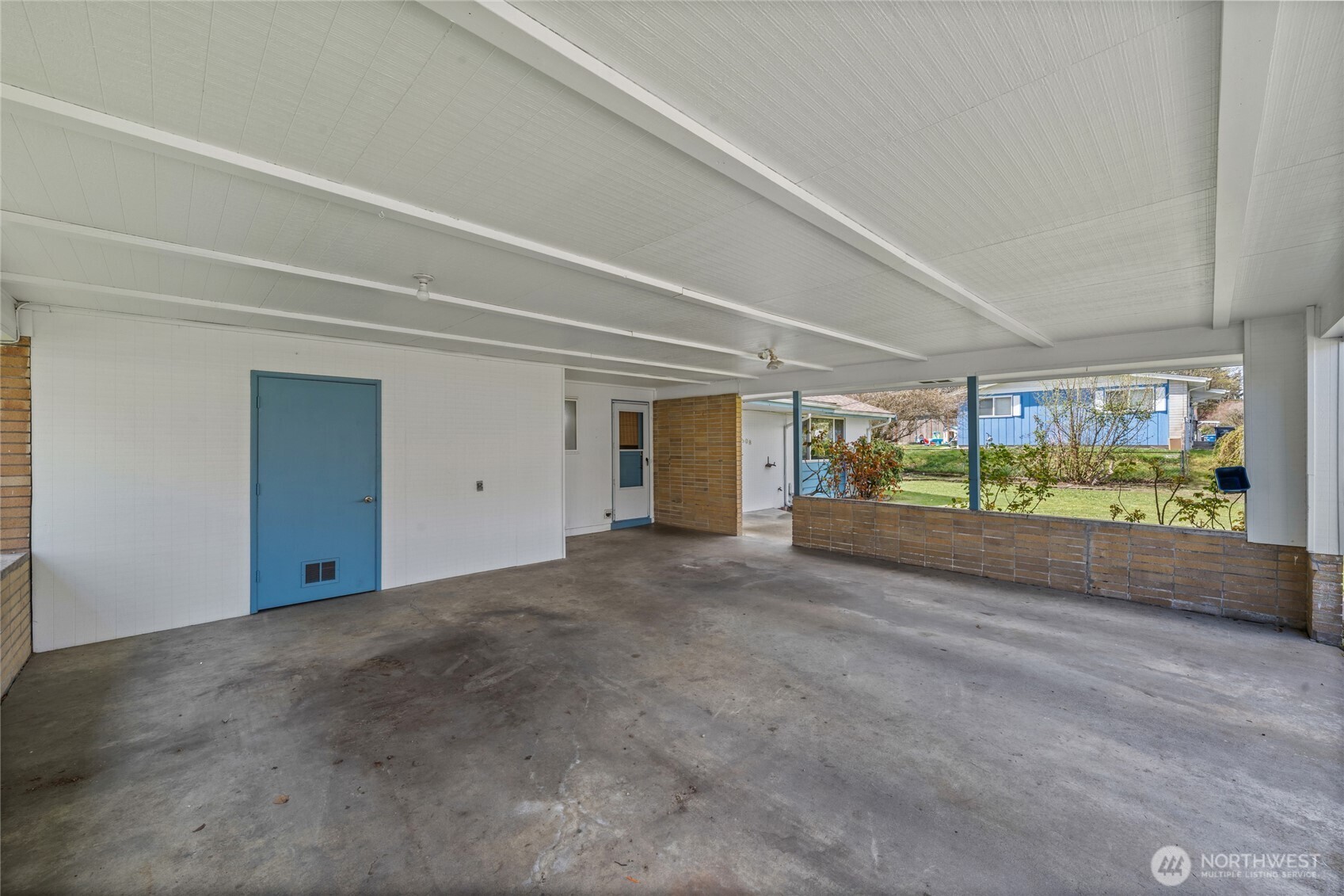 2 car covered carport with convenient homeowner entrance.
