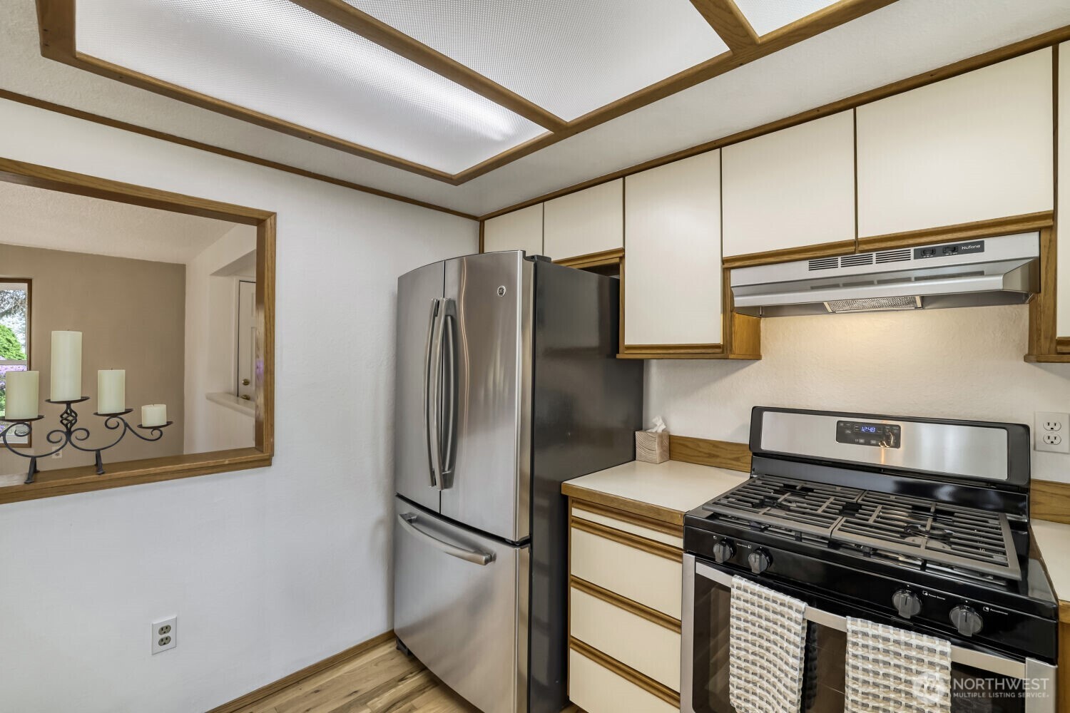 New gas range, stainless sink, dishwasher and fridge