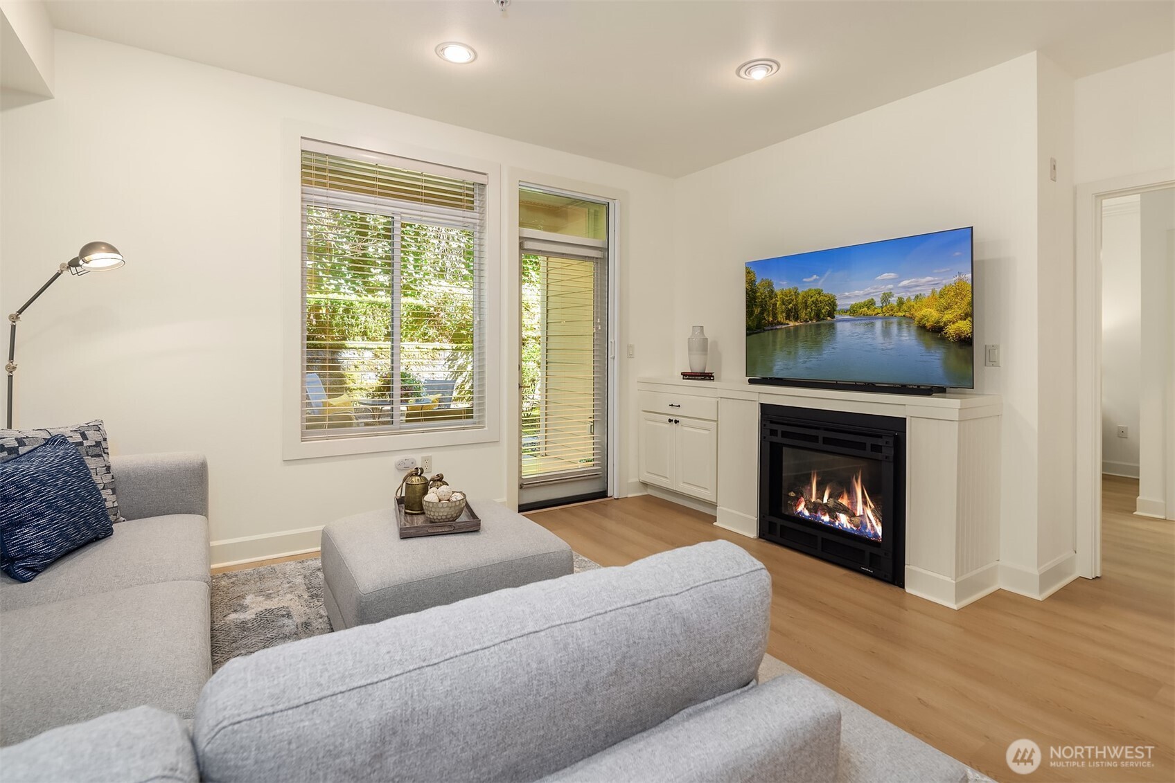 Electric fireplace provides ambiance for chilly nights.  Retractable screen door to patio