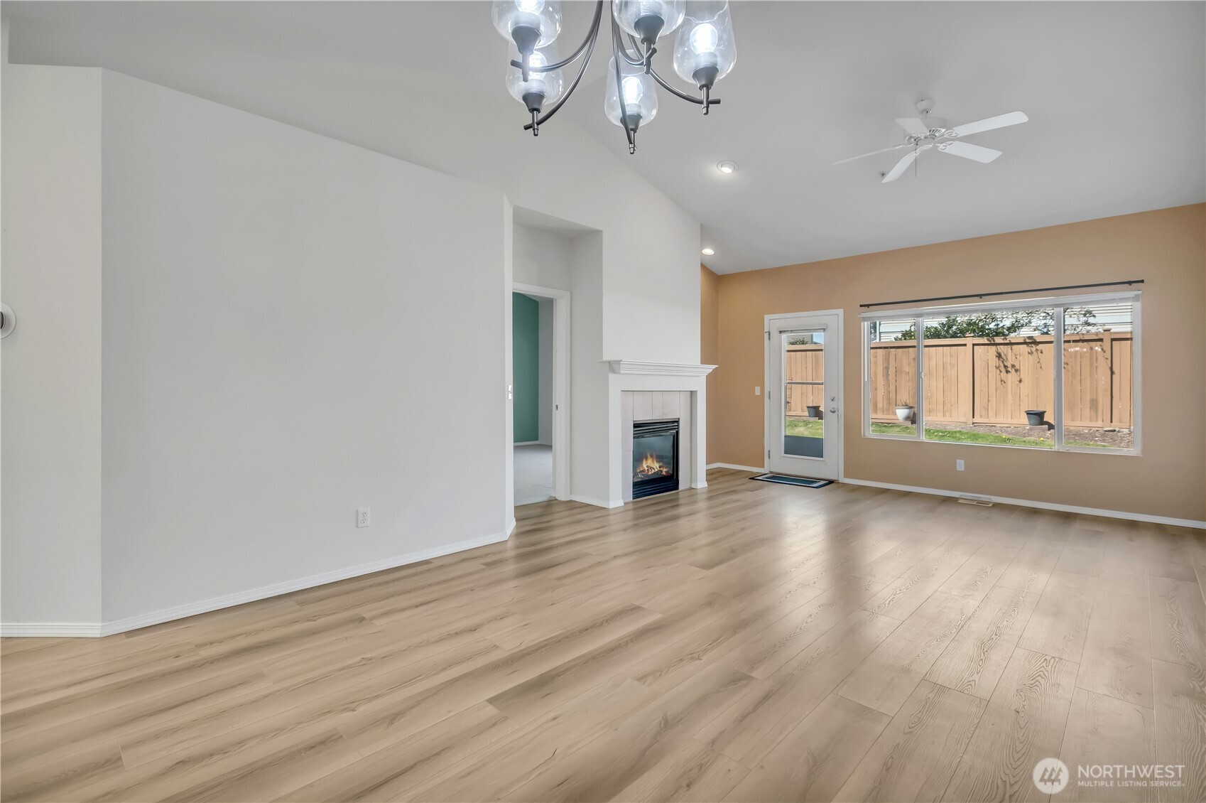 Gas fireplace & big window looks out to the patio ~