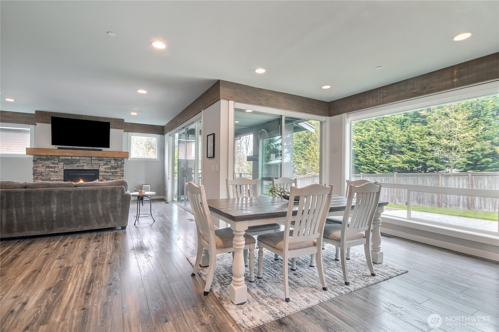 Open concept floor plan with floor to ceiling windows bring in tons of natural light.