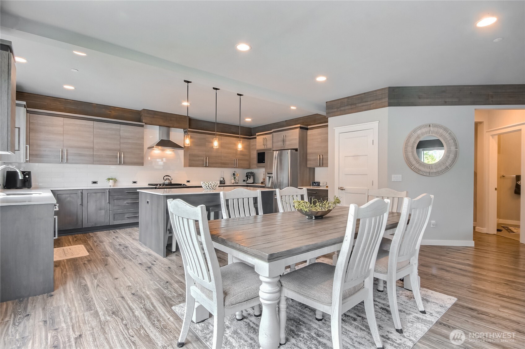 The open concept layout is complemented by wide plank flooring, natural light & stylish finishes. Spacious living areas provide comfort & flexibility the thoughtfully designed layout offers both privacy & flow.
