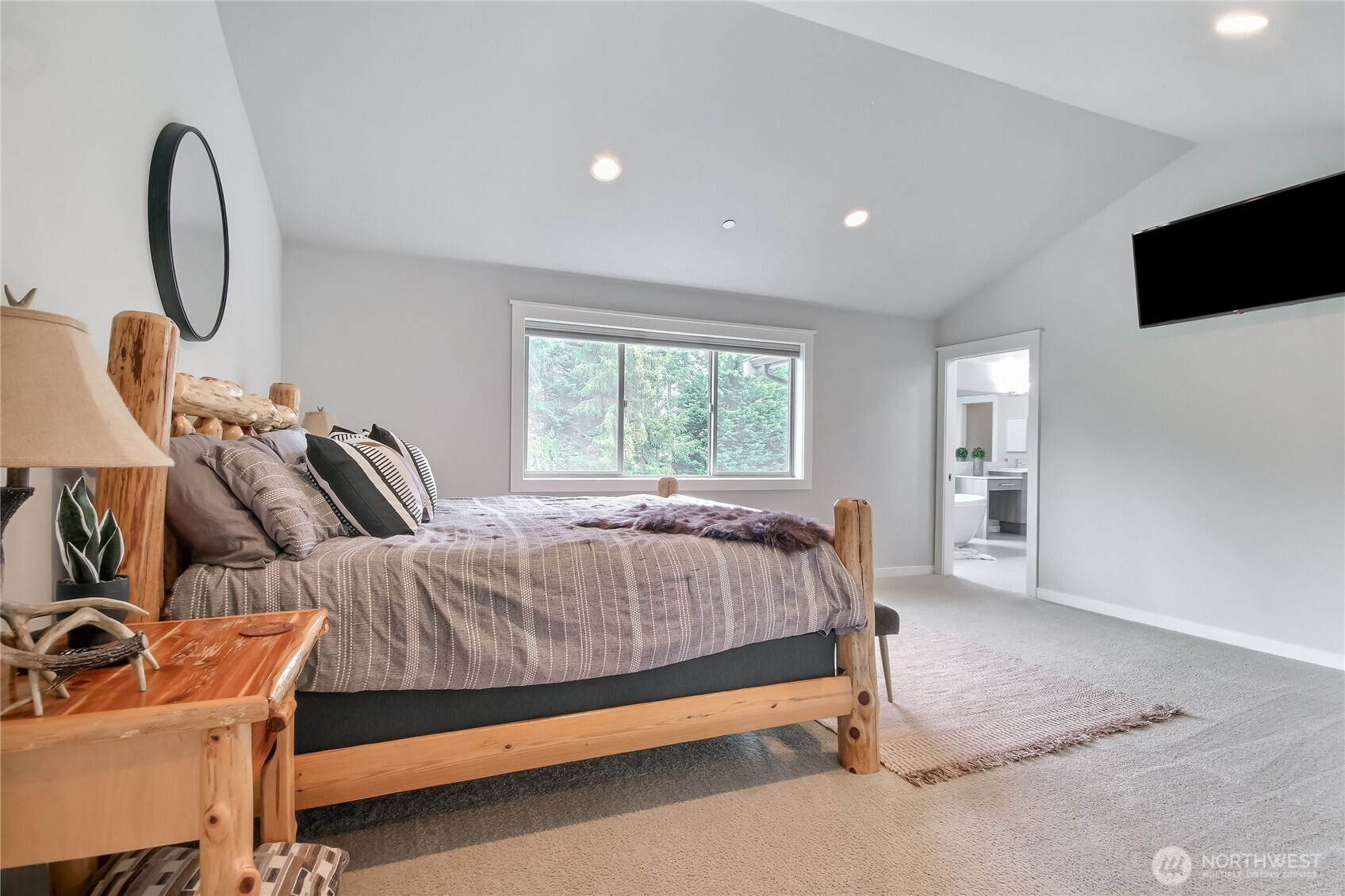 Covered outdoor deck with gas fireplace perfect for year round enjoyment.