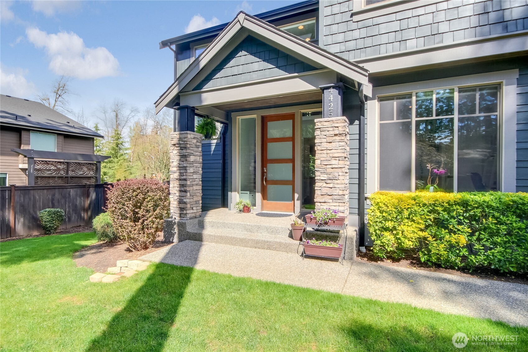 Stone columns and covered front porch.