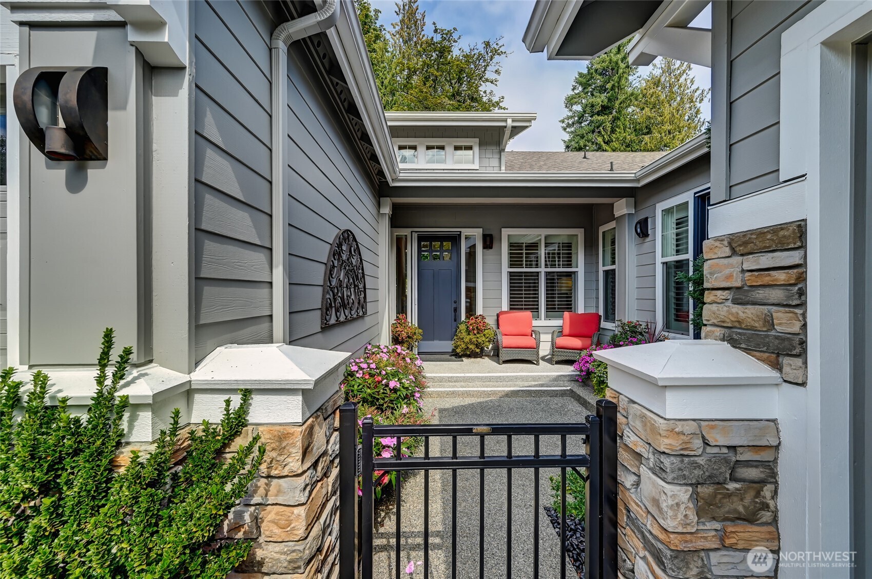 The front door was replaced in 2023 with a solid wood door and the existing French doors were painted to match.