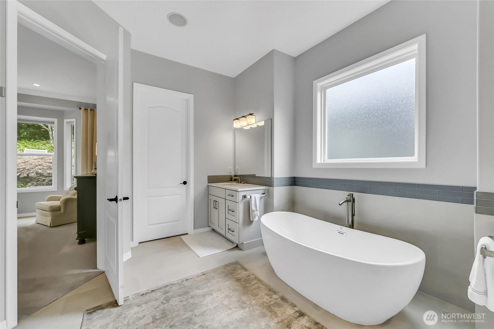 New flooring tile, Kohler undermount sinks, Hans Grohe faucets and a Toto toilet added in 2022.