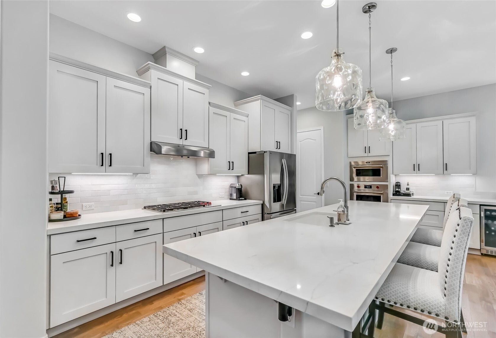 In 2024 the quartz counters, tile backsplash and beverage fridge were added. Enjoy under cabinet lighting and pull-out shelves.