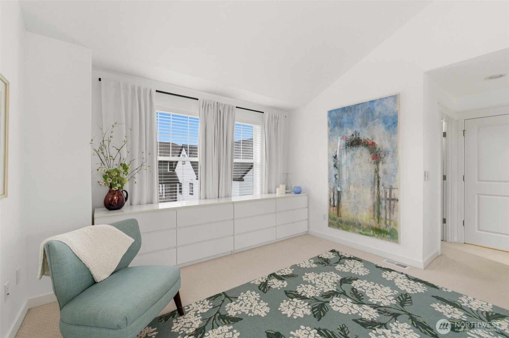 Primary bedroom with loads of additional space and natural light.