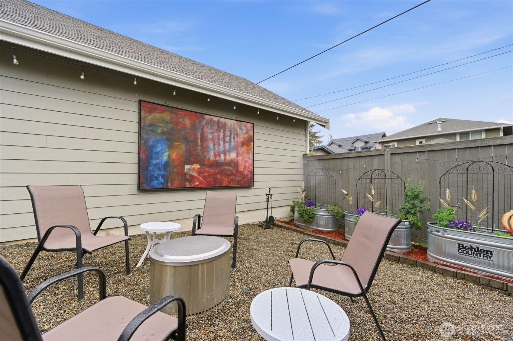 Additional space next to the garage to relax with a firepit.