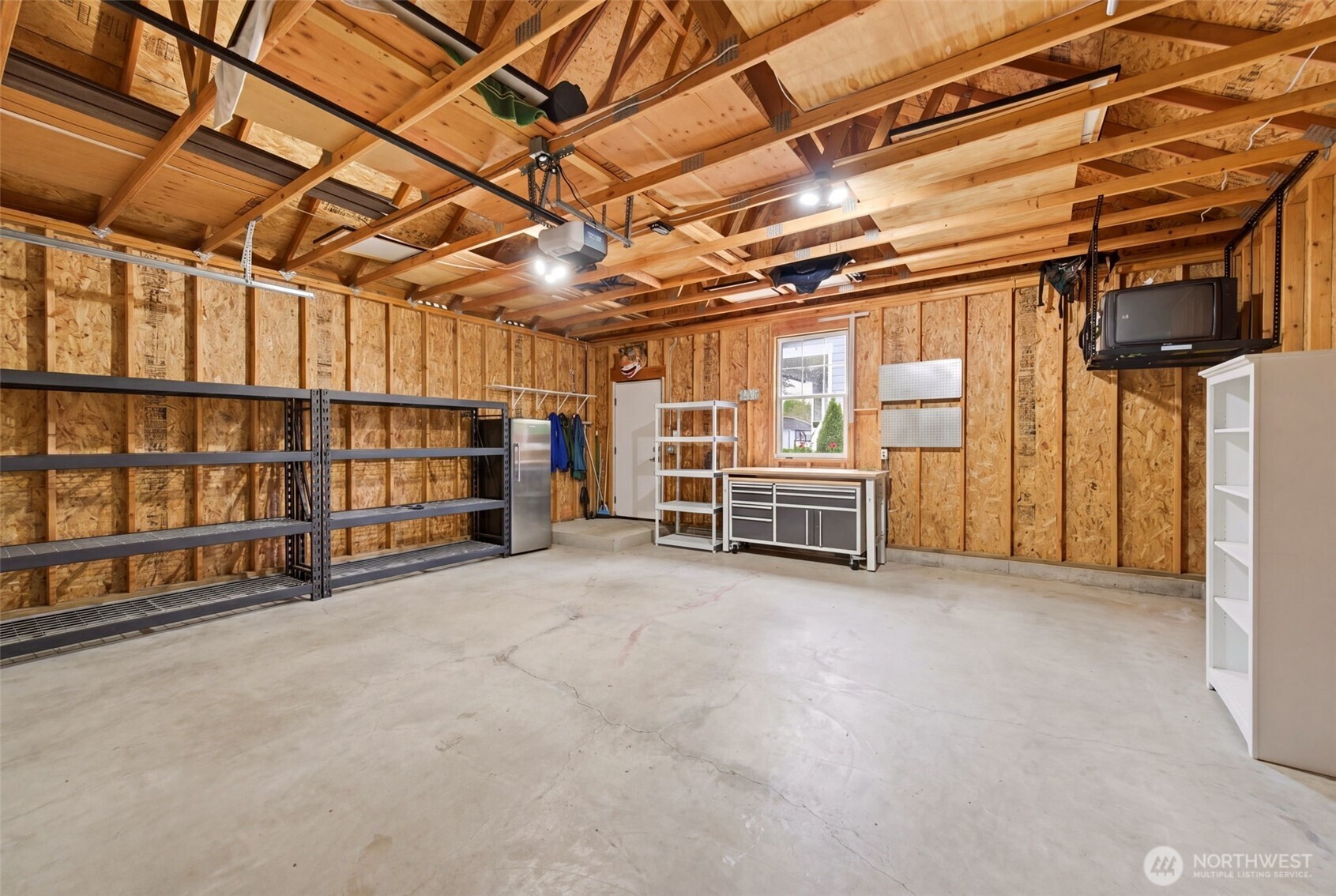 Large two car garage with loads of space for additional storage.