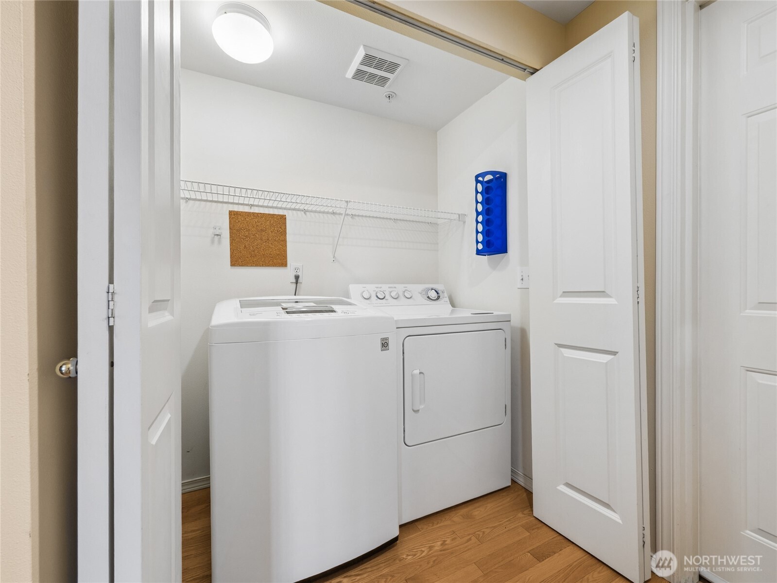 The main floor laundry room is in the back hallway along with a coat closet, the half bath and garage access. Good spot to drop the greasy or grassy clothes to be washed!